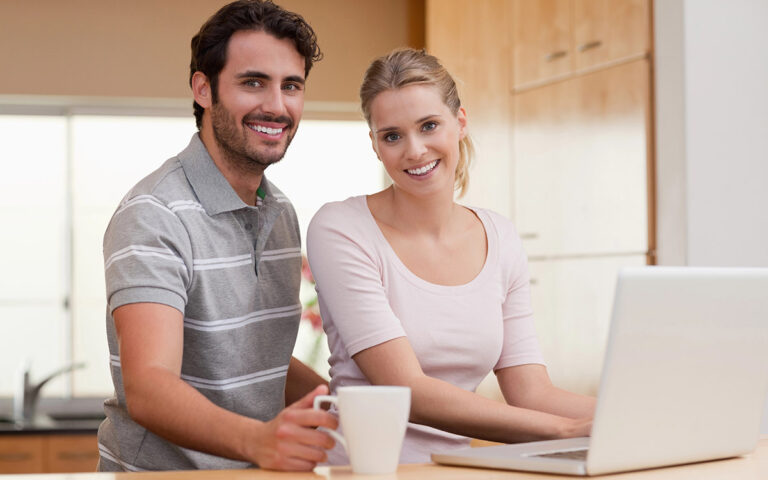 happy couple talking about savings