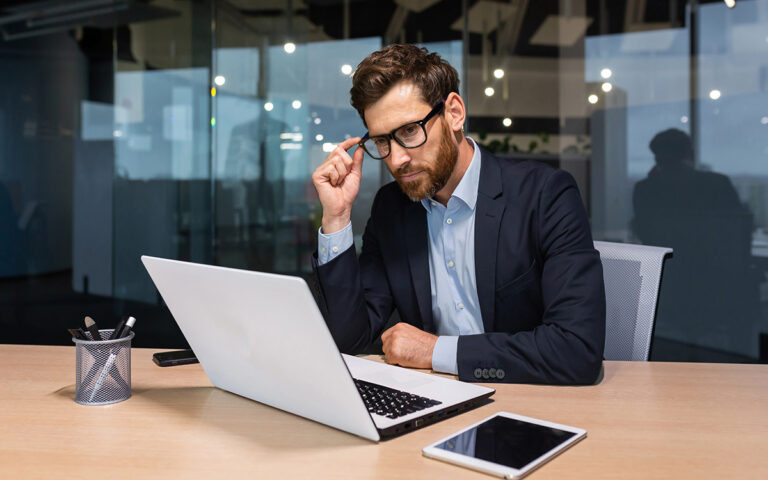 businessman working at the office on his laptop