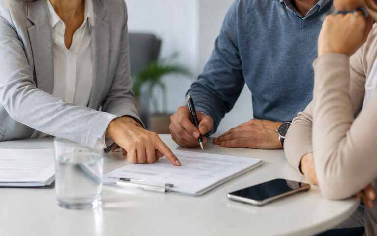 man signing a document at the office